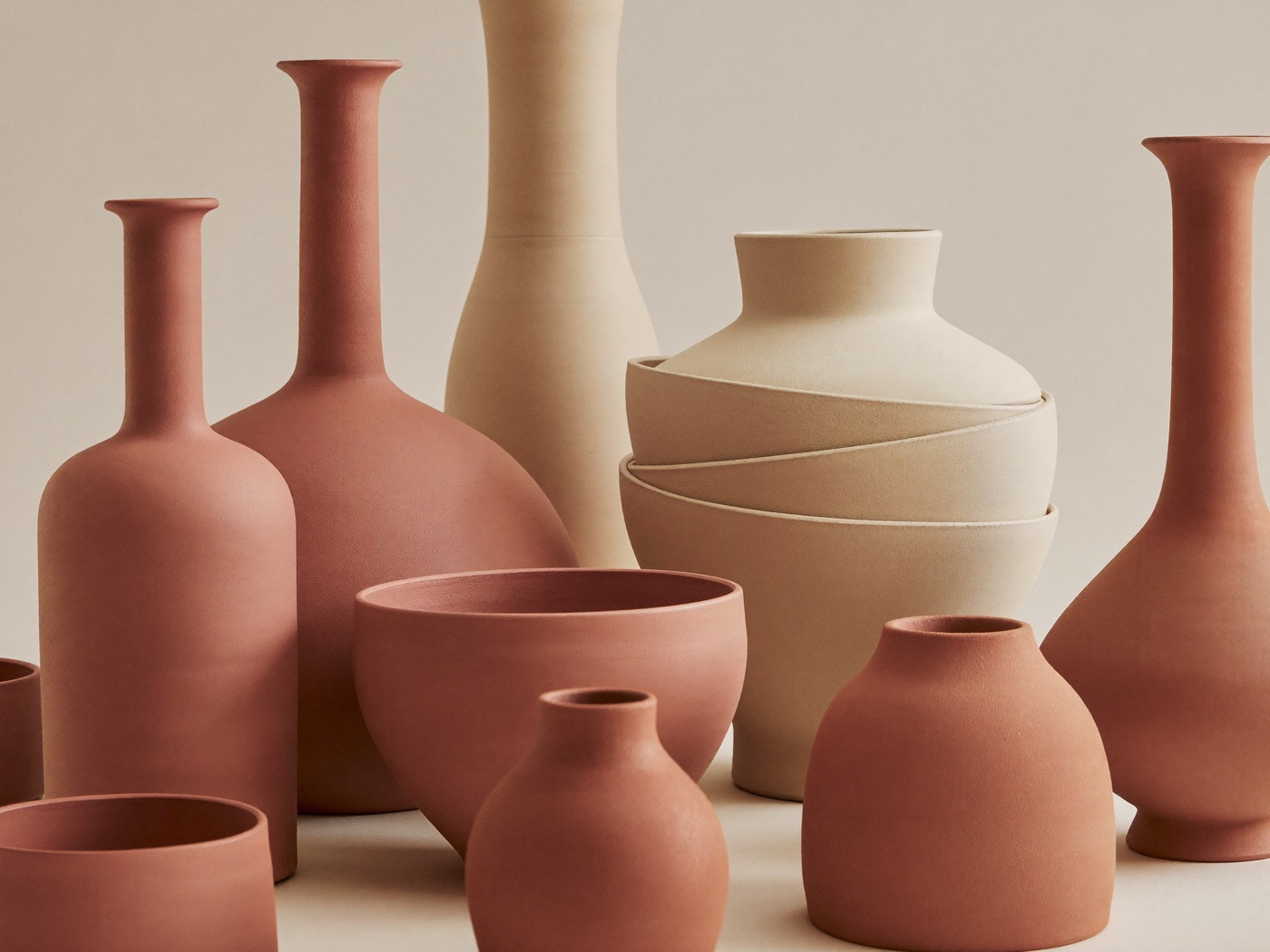 Stacked terracotta and cream bowls